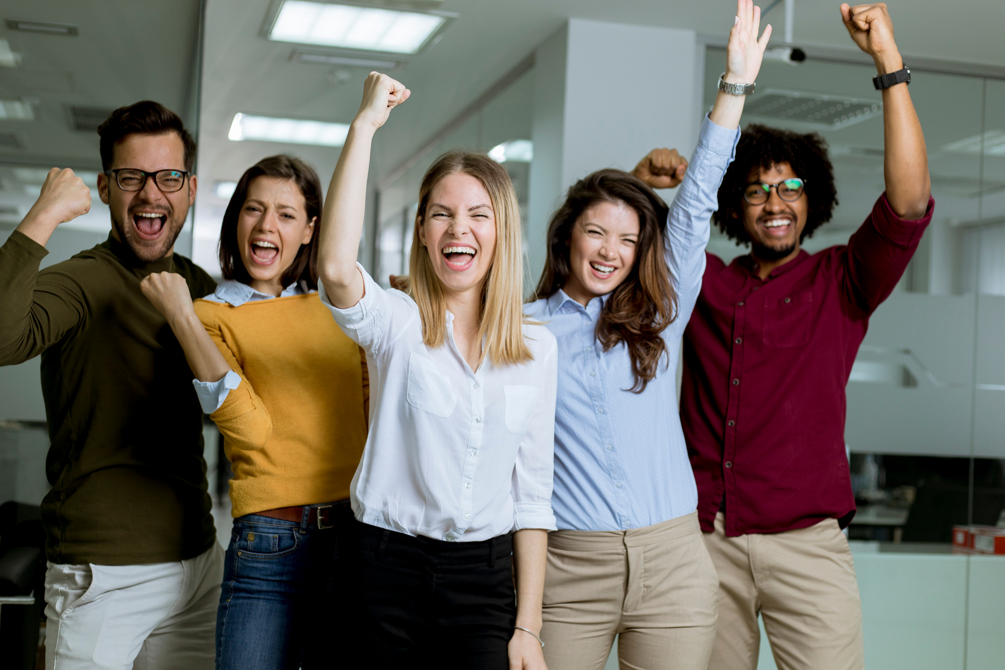 Group of Young Excited Business People with Hands up  Standing I